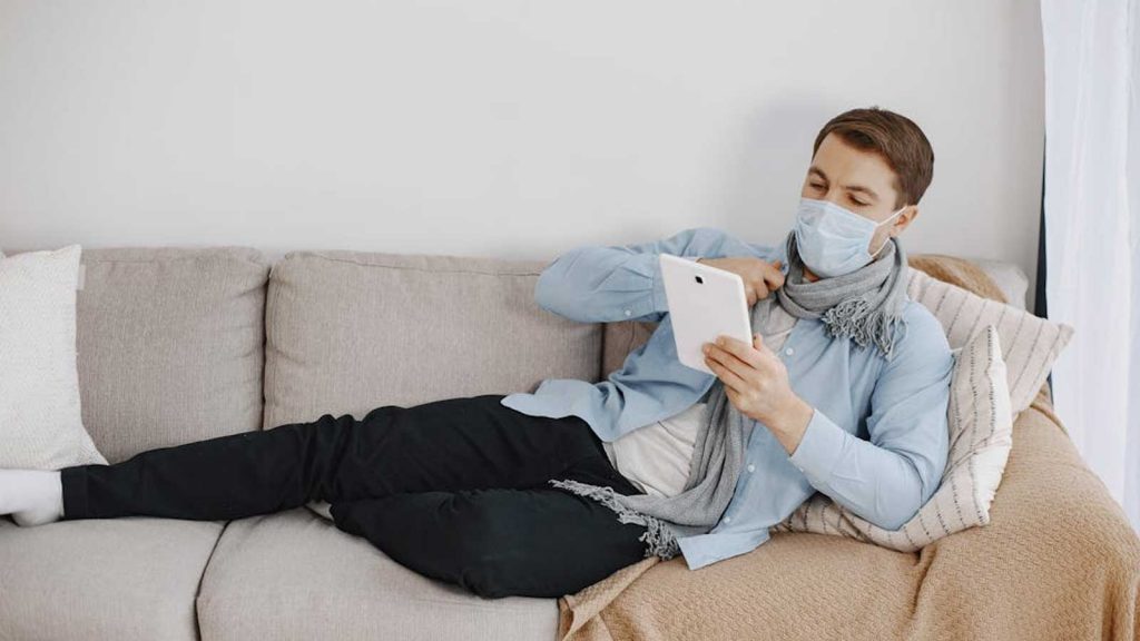 Man Reading with Pillow on the Back